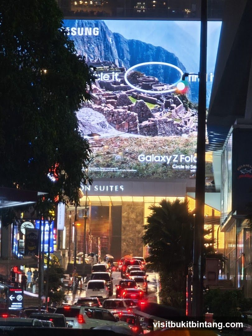 Nighttime City Street with Advertisement