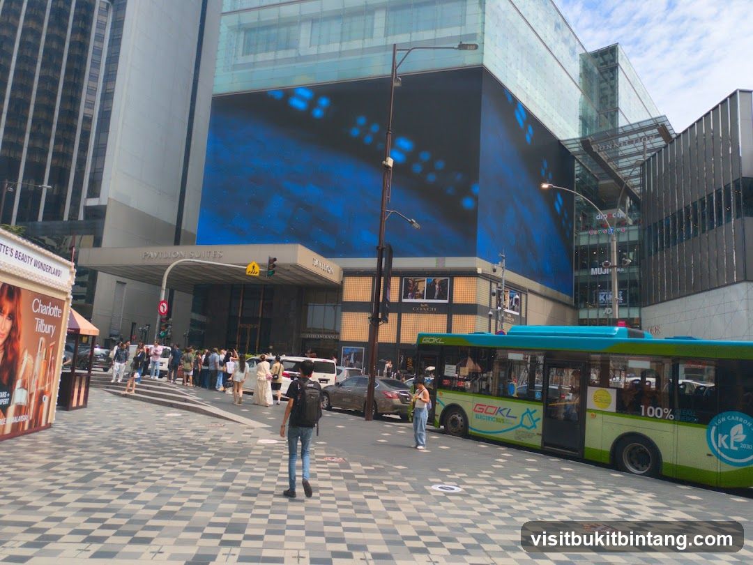 Street Scene with Pavilion Suites and Bus