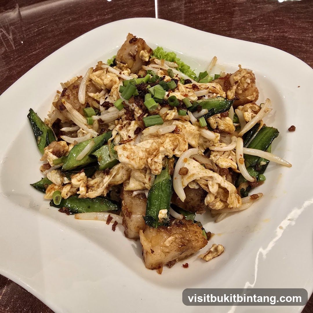 Stir-fried dish with turnip cake, egg, and vegetables