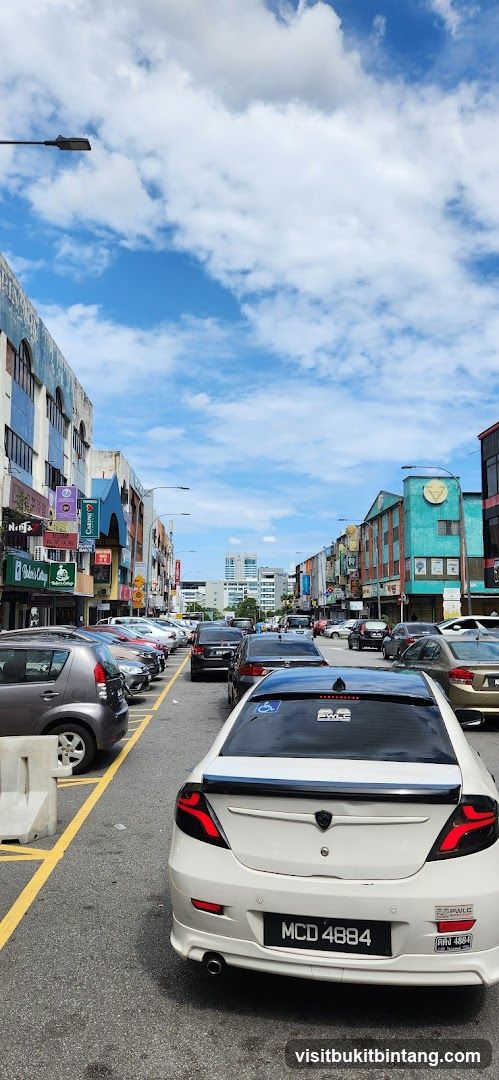 Street view with parked cars and buildings