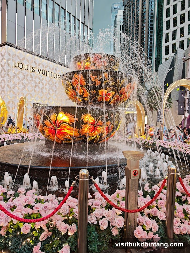 Fountain with Louis Vuitton Store Facade