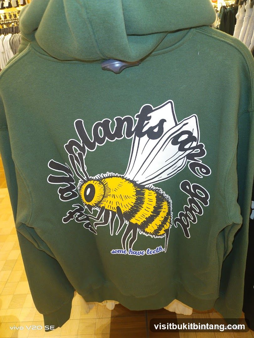 Green hoodie with bee graphic