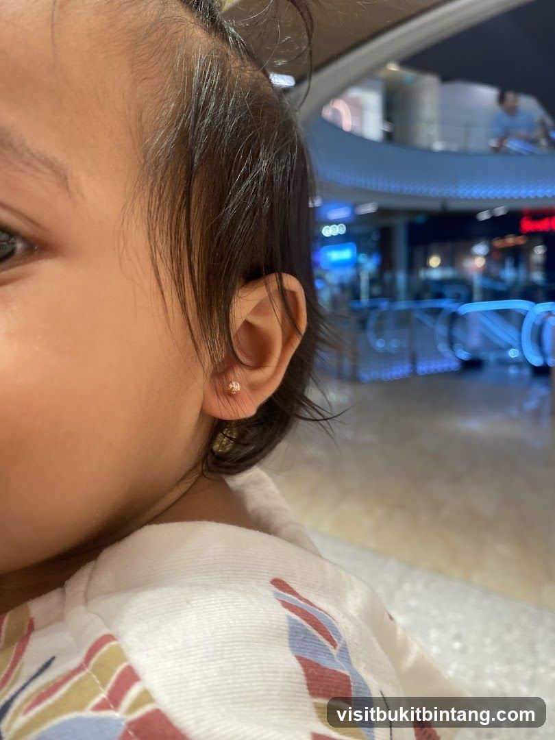 Close-up of a child's ear with an earring