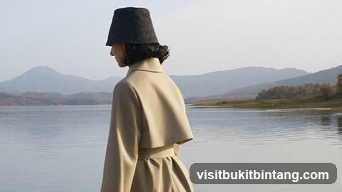 Woman in Hat by Lake