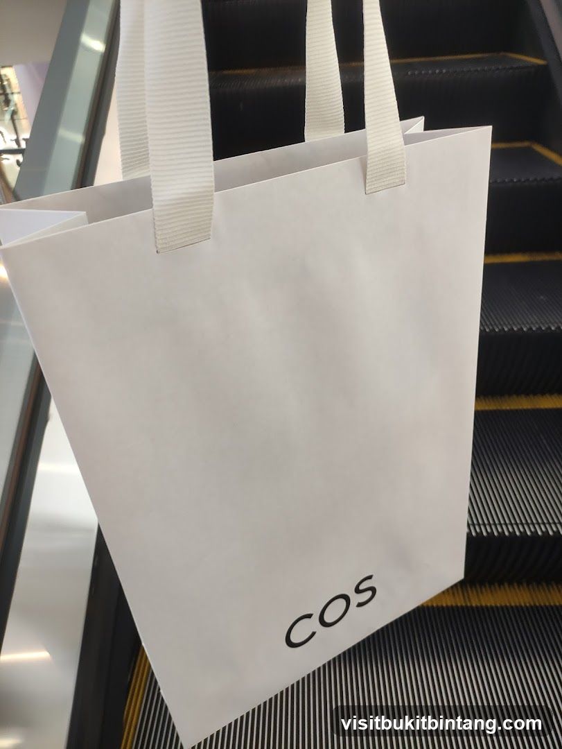 Shopping bag on escalator