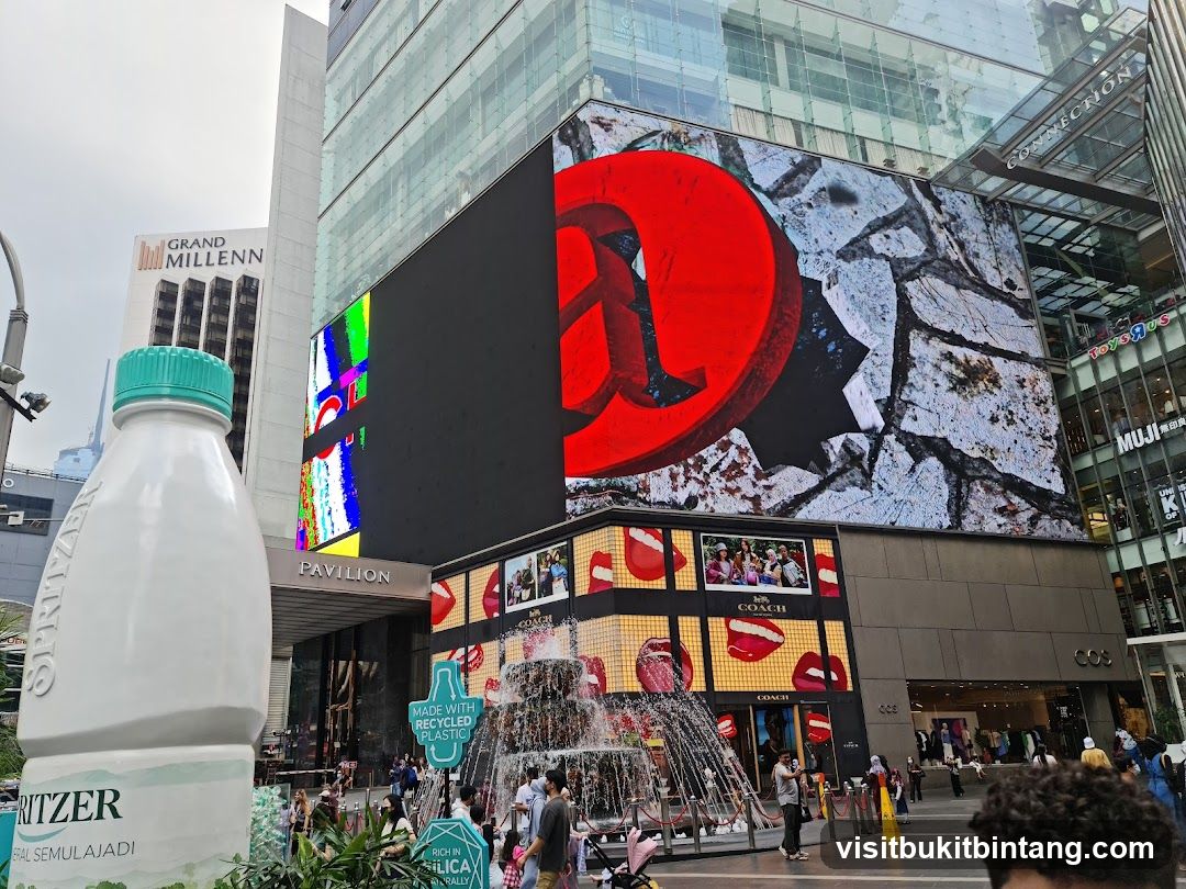 Urban Street Scene with Large Bottle Prop and Digital Billboards