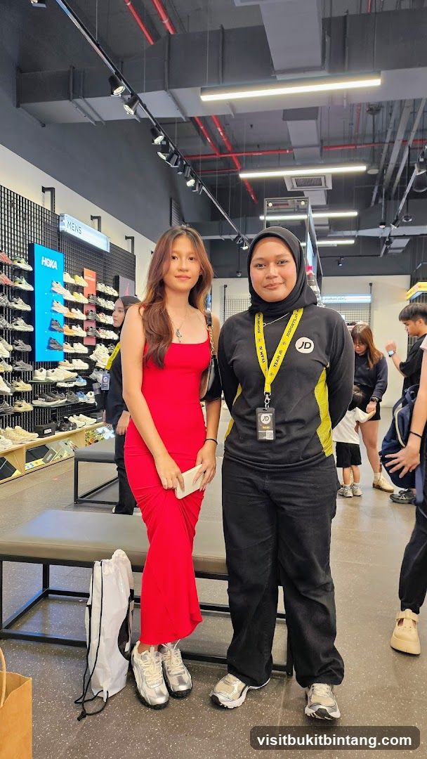 Two women posing in a shoe store