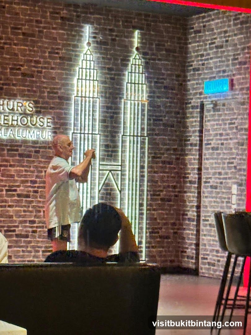 Interior of a bar with Petronas Towers neon art