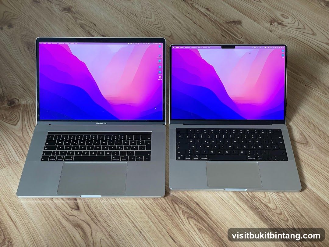 Two MacBooks on a wooden floor