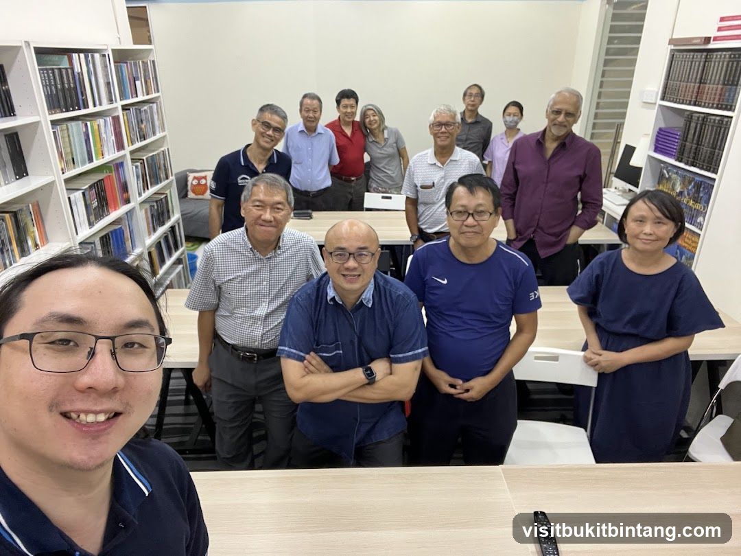 Group Photo in a Room with Bookshelves