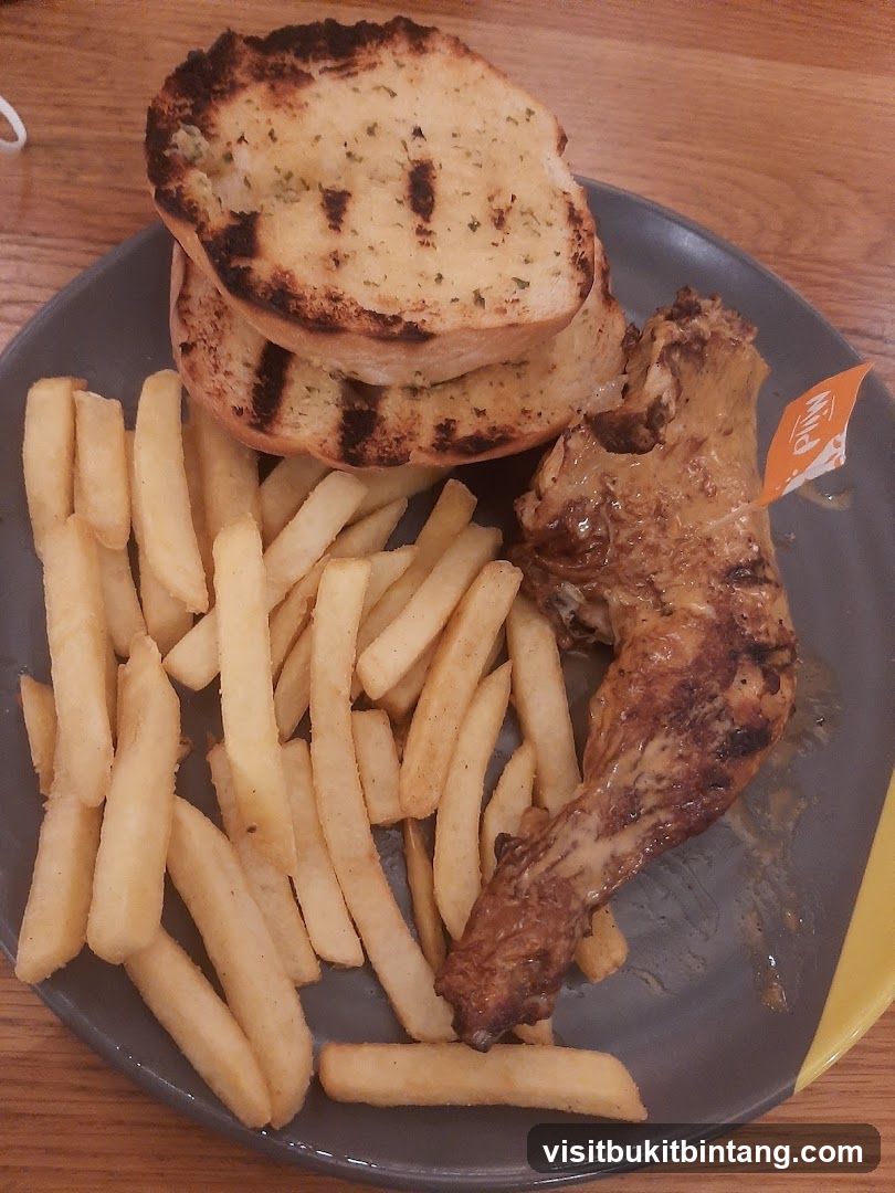 Chicken Meal with Fries and Garlic Bread