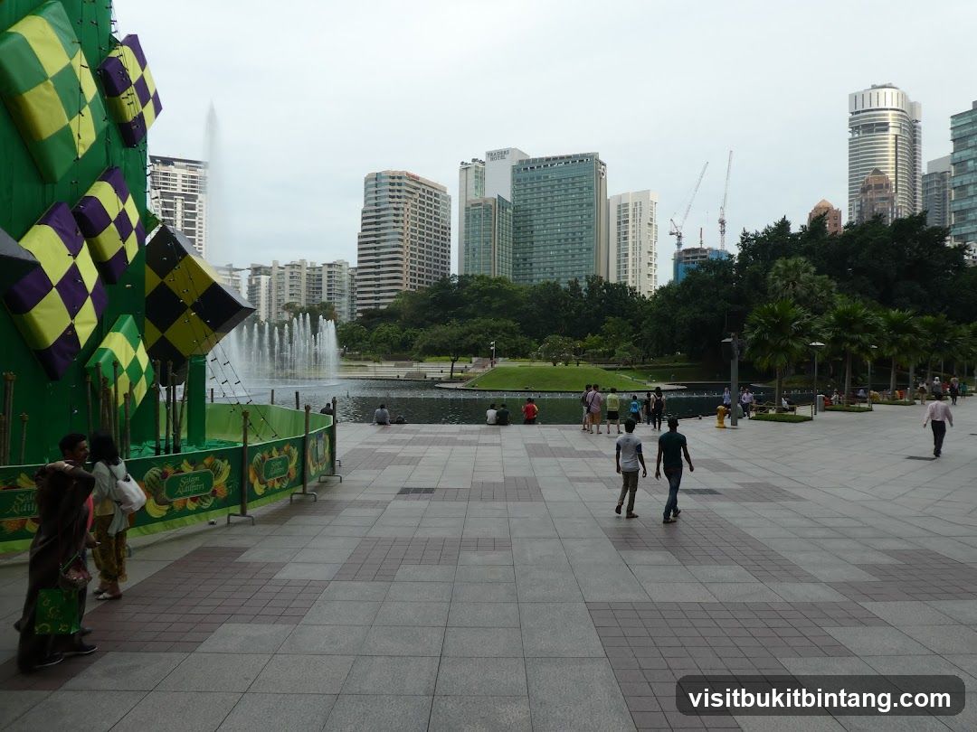 City Park with Fountain and Buildings