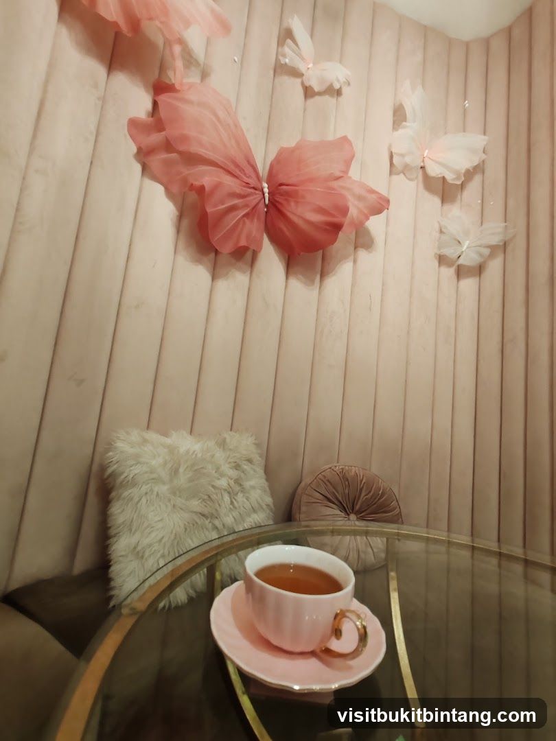Tea cup on a table with decorative butterflies on the wall