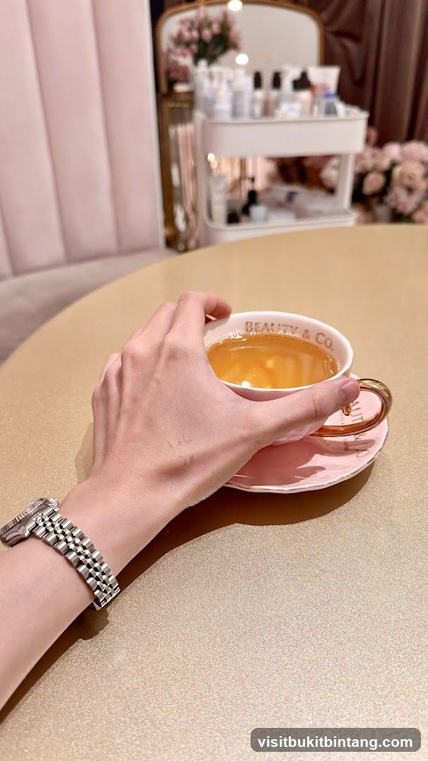 Hand holding a teacup