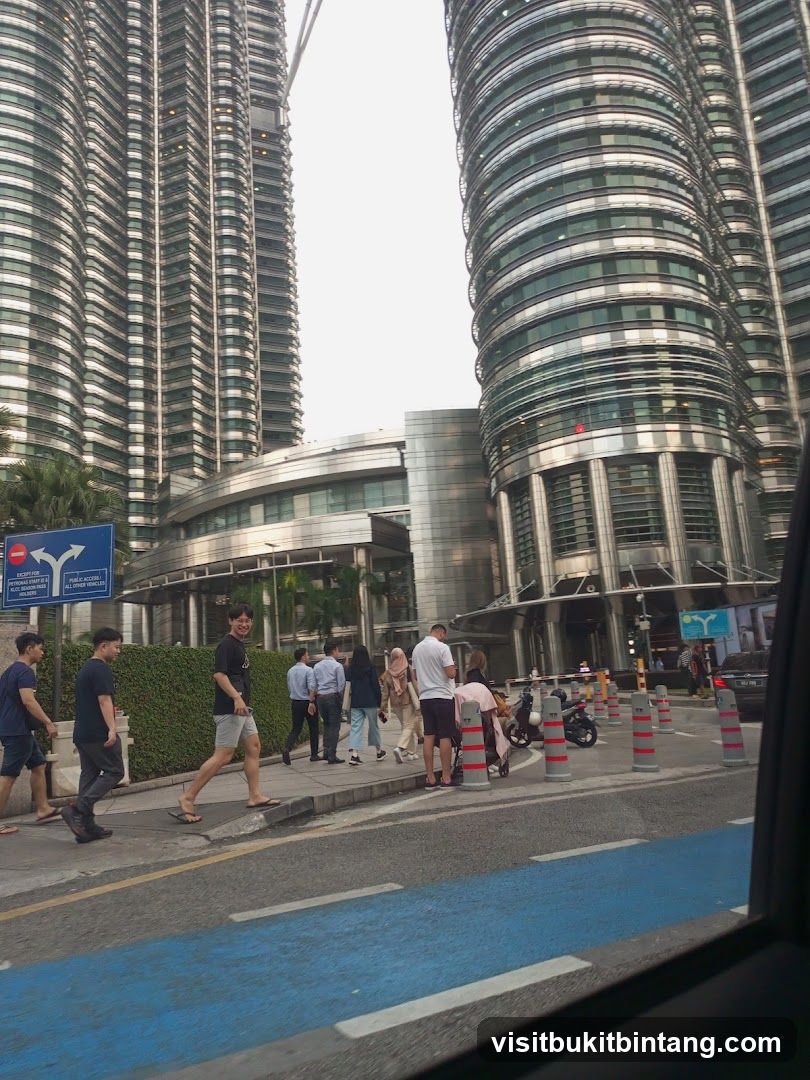 People walking near modern skyscrapers