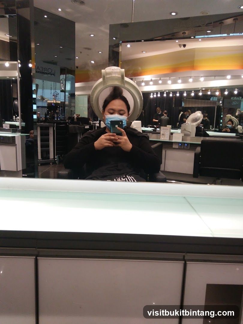 Woman using hair steamer