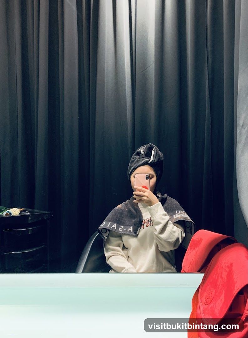 Woman taking a selfie in a salon