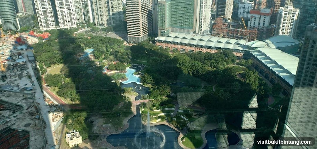 City Park with Water Features and Surrounding Buildings
