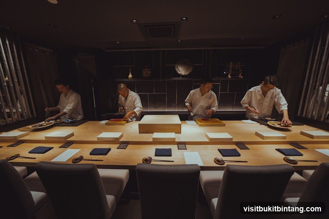 Chefs preparing food at a sushi bar