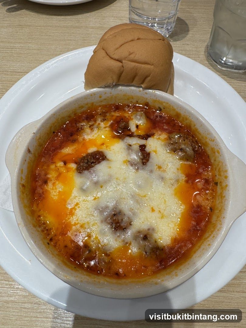 Baked Dish with Cheese and Bread Roll