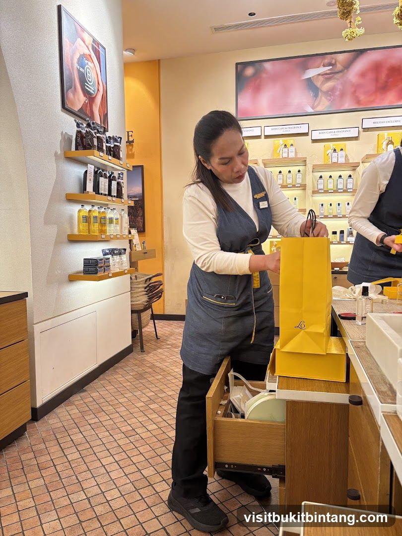 Staff member packing a shopping bag