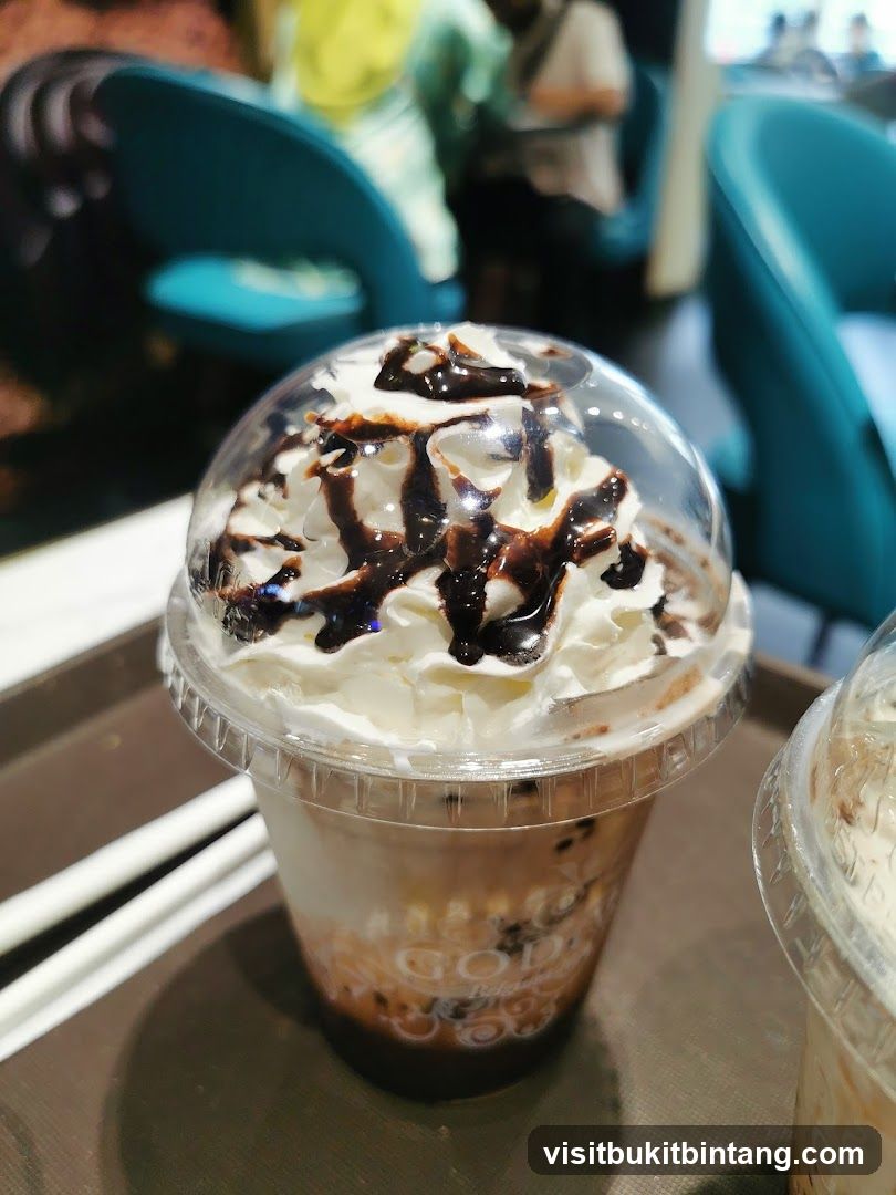 Iced Coffee Drink with Whipped Cream and Chocolate Drizzle