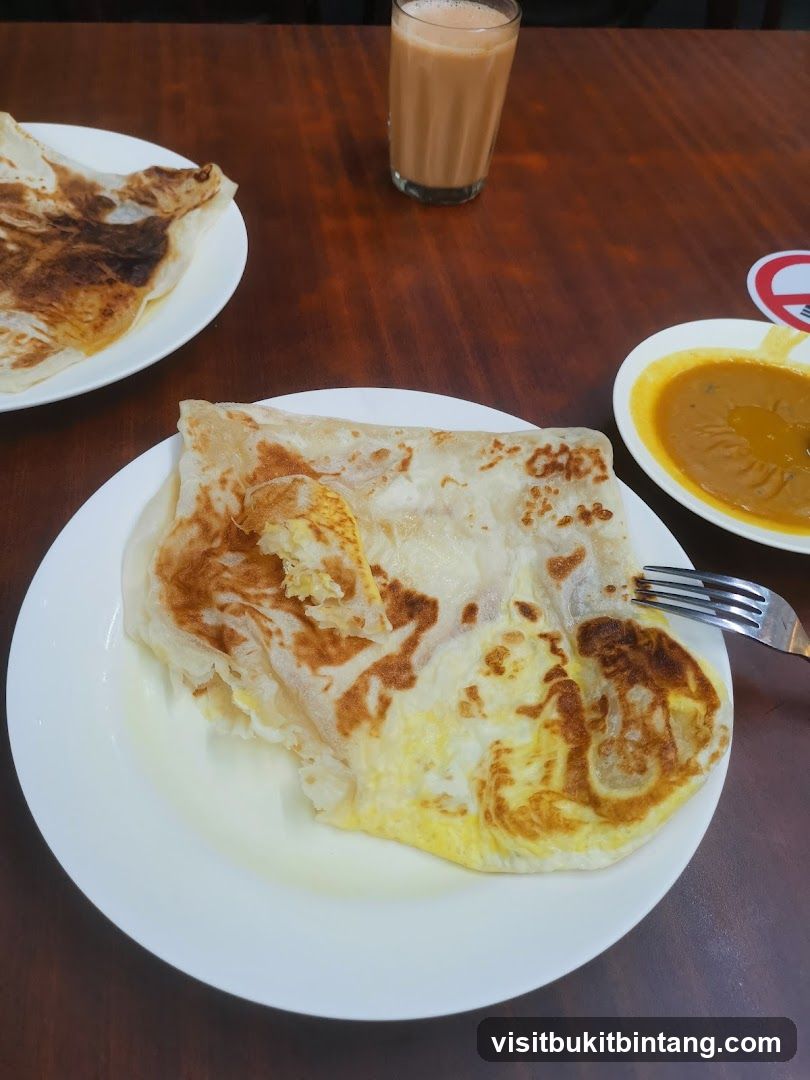Roti Canai with Curry and Tea