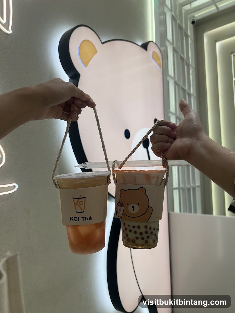 Two drinks with bear and logo