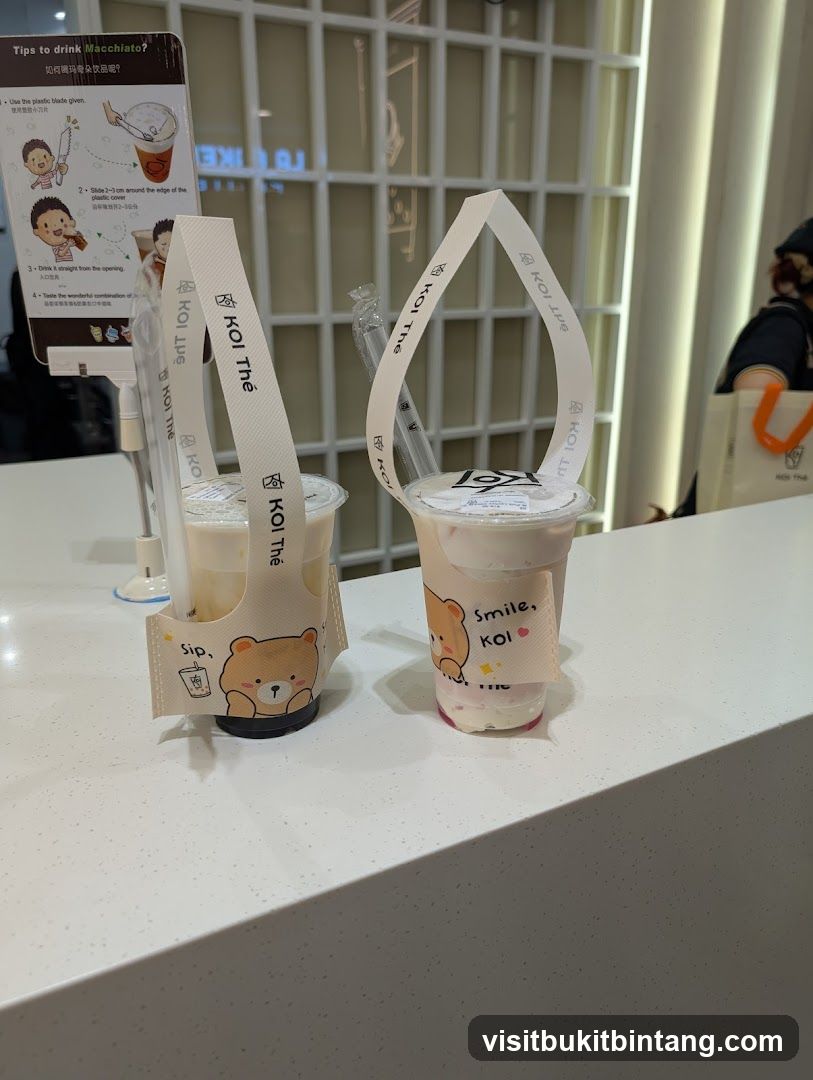 Two drinks with branded sleeves