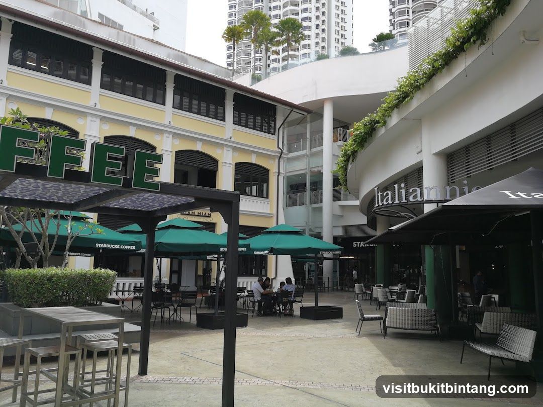 Outdoor seating area with Starbucks and Italian restaurant