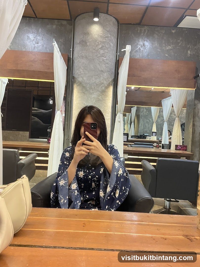 Woman taking a selfie in a salon