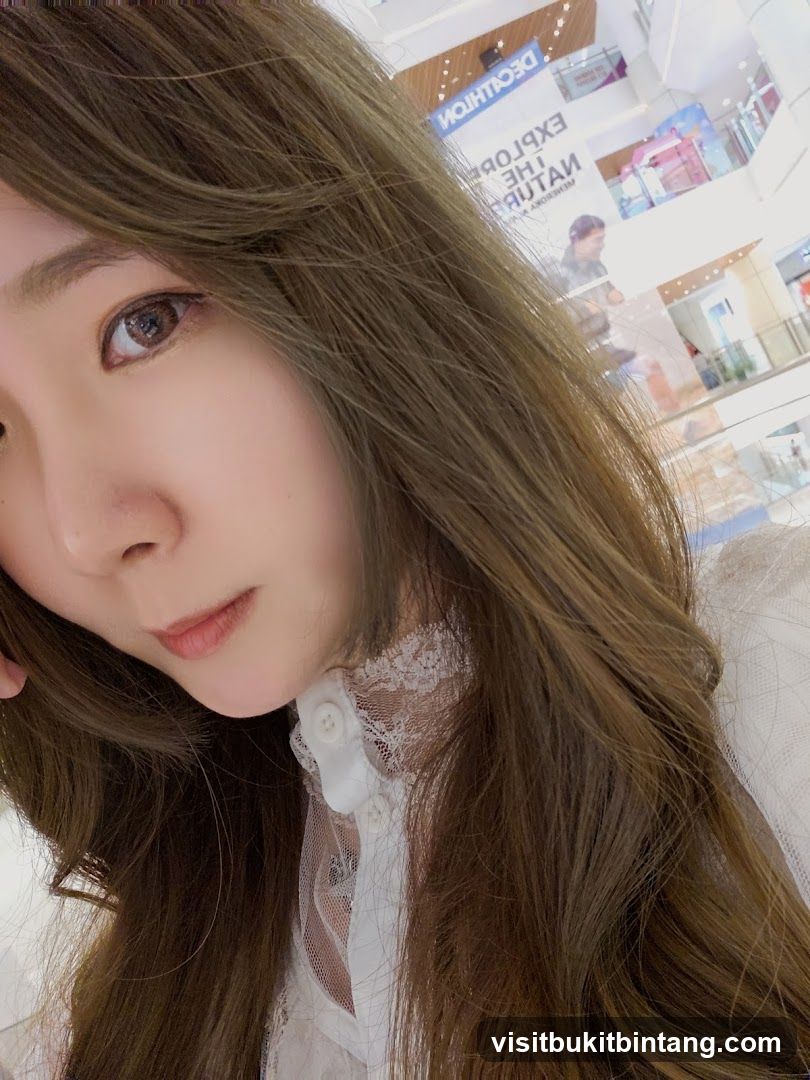 Woman in a white lace-trimmed blouse