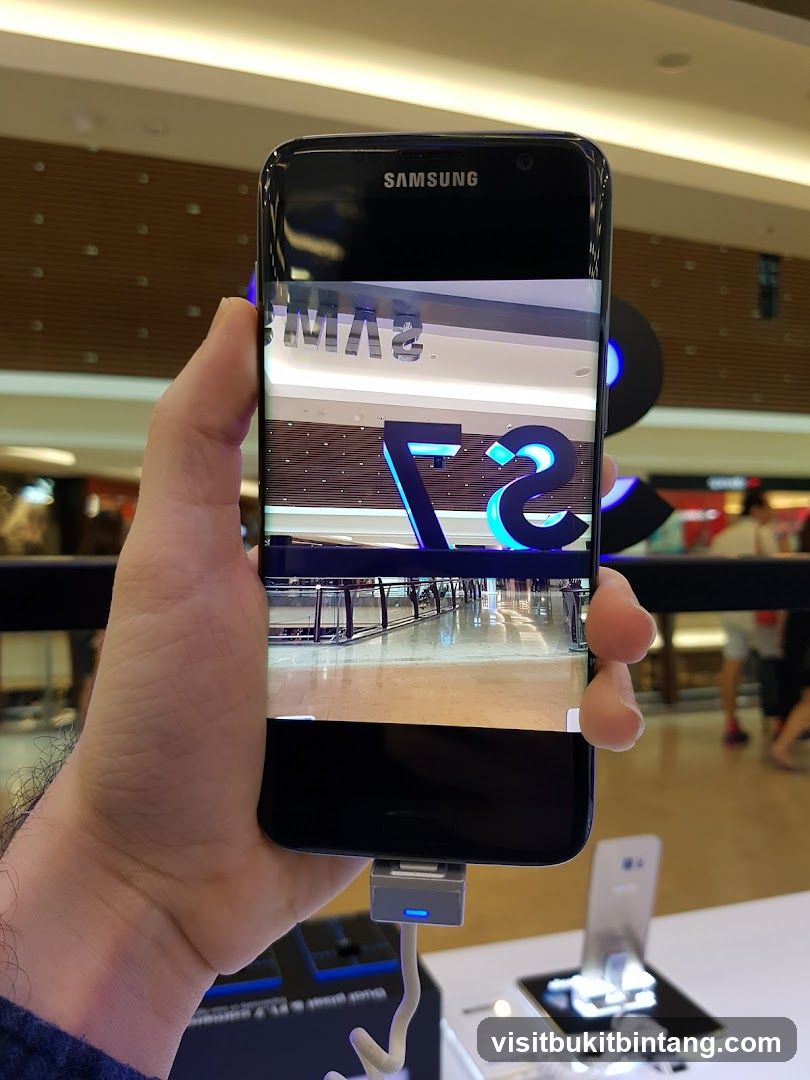 Samsung phone displaying a reflection of a store interior