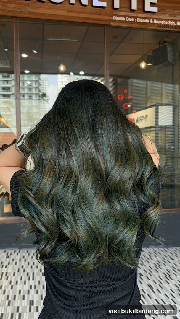 Woman with dark green wavy hair