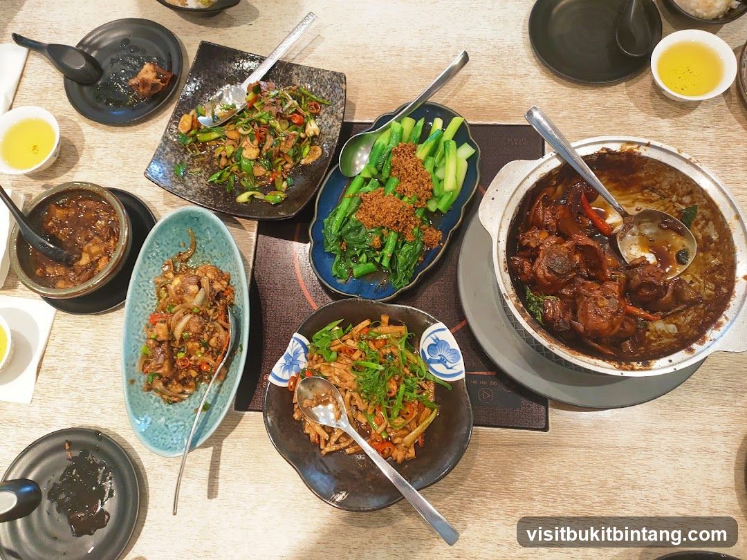 Overhead view of a table laden with various Chinese dishes