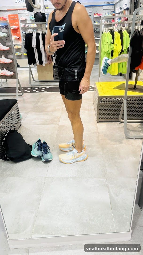 Man trying on shoes in a store