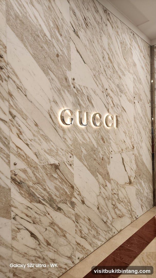 Gucci Logo on Marble Wall