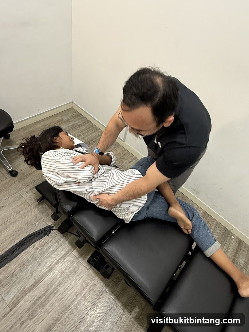 Chiropractor adjusting patient
