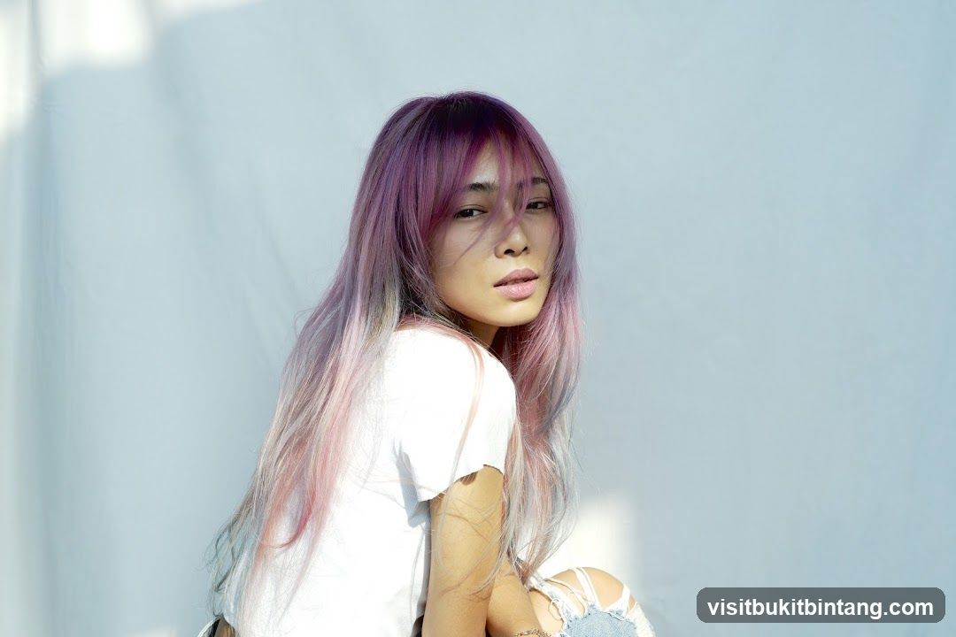 Woman with purple and pink ombre hair
