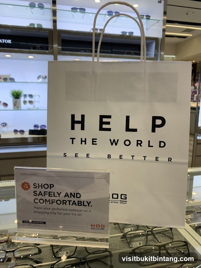 Eyewear store display with shopping bag and safety sign