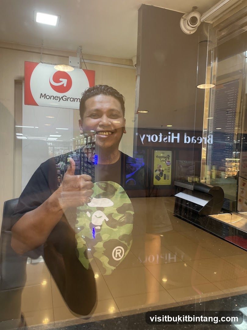 Man giving a thumbs up in front of a MoneyGram sign