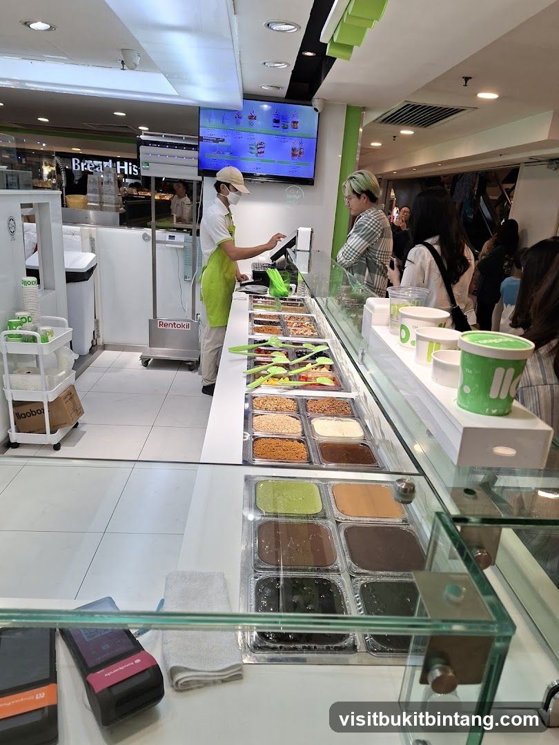 Dessert shop counter with toppings and flavors