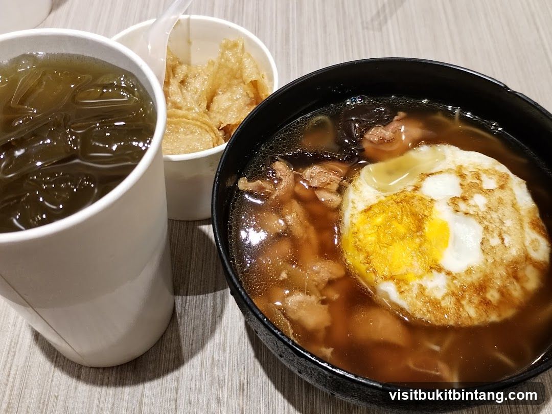 Noodle Soup with Fried Egg and Drink