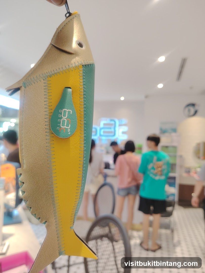 Fish-shaped pouch with logo