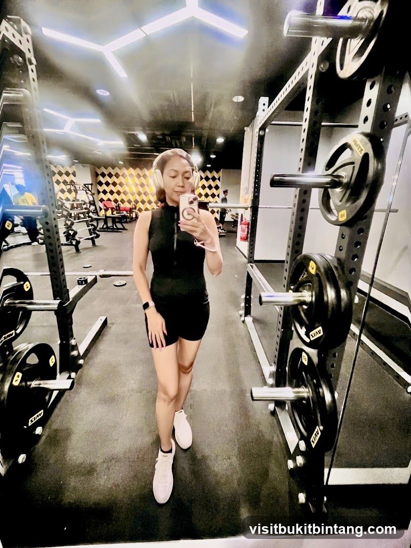 Woman taking a selfie in a gym