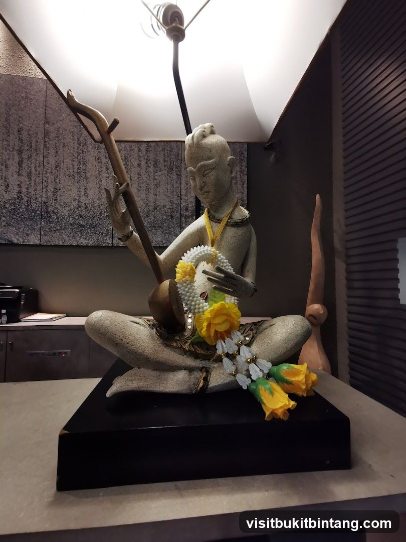 Statue with Musical Instrument and Garland