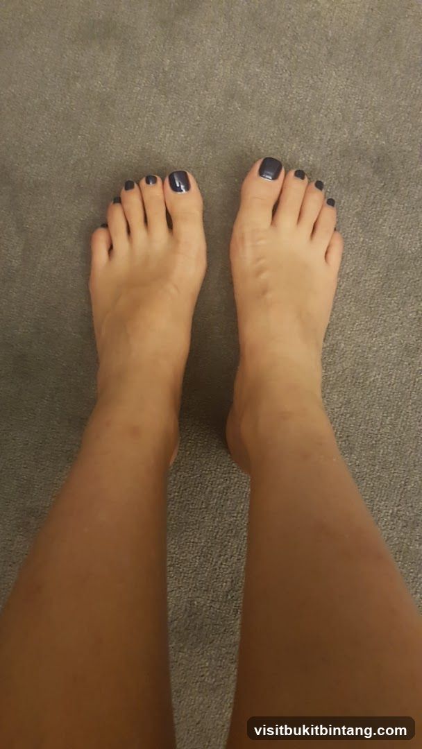 Feet with dark nail polish