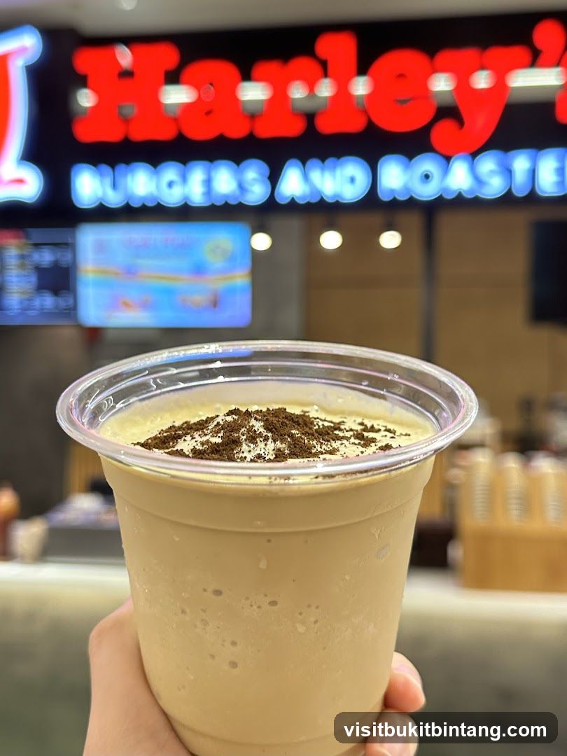 Beverage with Harley's Burgers and Roasted Sign