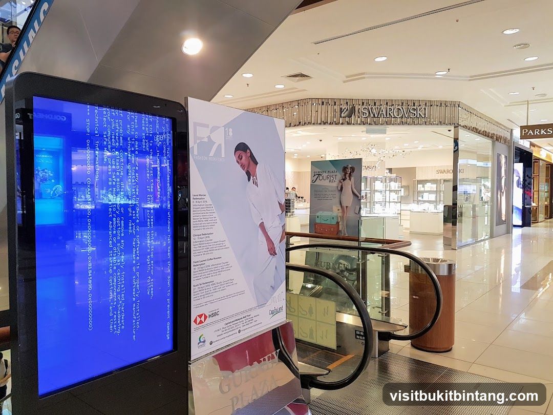 Mall Interior with Digital Display and Storefronts