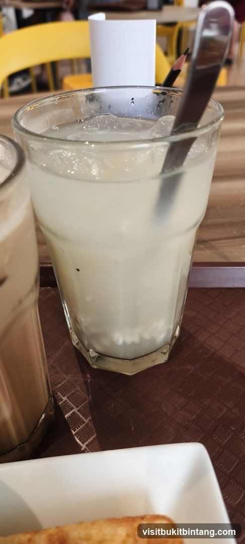 Iced Drink with Spoon and Pencil